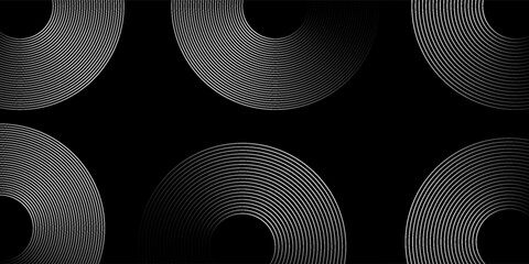 Abstract background with circular line patterns on black background.