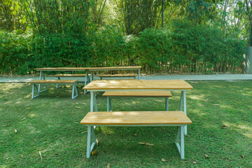 Backyard and garden furniture ,table and chairs in park for rest or picnic,beautiful designer garden,Natural landscaping,copy space..