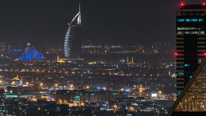 Aerial view of a big modern city at night timelapse. Business bay, Dubai, United Arab Emirates.