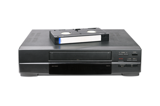 Classic VCR with cassette lying on top isolated on white background.