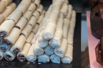 Delicious fruit leather rolls on white background