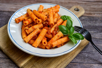  Pasta bolognese .Italian home made meal Fresh   maccheroni pasta with tomato sauce, basil, herbs ,parmesan cheese ,fresh cherry tomatoes and parsley on wooden background. Kitchen Poster 