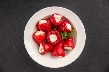 Hot peppers cheese filling pickled vegetables appetizer fresh delicious gourmet food vegetarian background on the table rustic food top view copy space keto and paleo diet