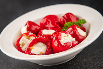 Hot peppers cheese filling pickled vegetables appetizer fresh delicious gourmet food vegetarian background on the table rustic food top view copy space keto and paleo diet