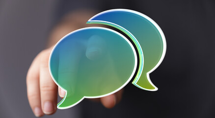 Abstract image of a hand interacting with digital speech bubbles, symbolizing communication, conversation, and connection.