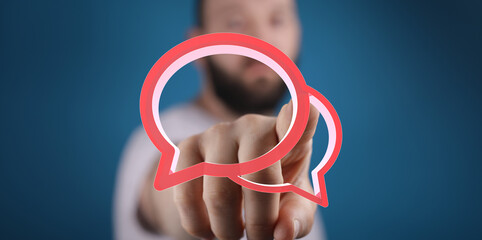 Image of a man interacting with digital speech bubbles, symbolizing communication, conversation,...