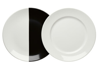 Isolated Juxtaposed Black and White Dinner Plates