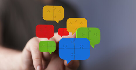Visual of puzzle pieces forming speech bubbles, symbolizing teamwork & communication.