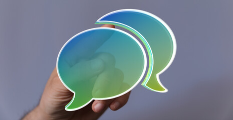 Abstract image of a hand interacting with colorful speech bubbles.  Perfect for communication, ...