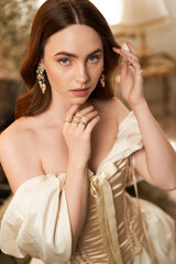 Elegant young woman exuding vintage beauty in a charming indoor setting