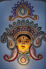 Fototapeta premium Magnificent Goddess Durga Idol Adorned with Flowers at Vibrant Kolkata Puja Pandals During Durga Puja Festival