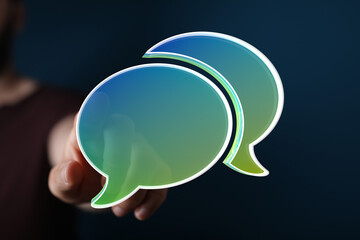 Abstract image of a hand reaching for vibrant speech bubbles, symbolizing communication and connection.