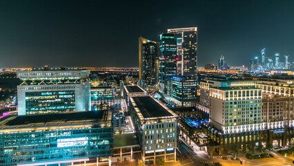 Fototapeta premium Dubai downtown architecture at night timelapse. Aerial view of numerous skyscrapers near Sheikh Zayed road.