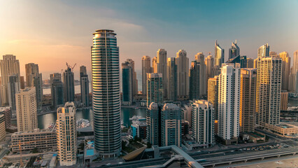 Aerial top view at sunset timelapse of Dubai Marina and JLT in Dubai, UAE