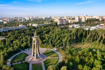 Naklejka na ściany i meble Aerial drone view of Victory park and the monument to the blockade of Leningrad in Bishkek, Kyrgyzstan