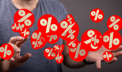 Abstract image of a person interacting with digital percentage symbols, representing discounts,...