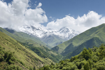 Fototapeta premium majestic caucasus mountains rise dramatically against backdrop of fresh spring greenery