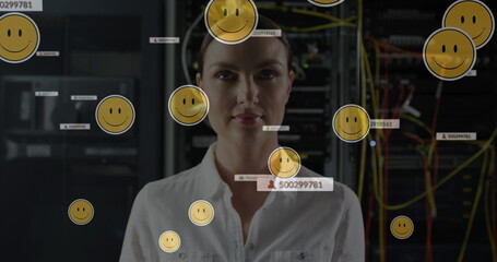 Image of falling icons over caucasian female server room worker