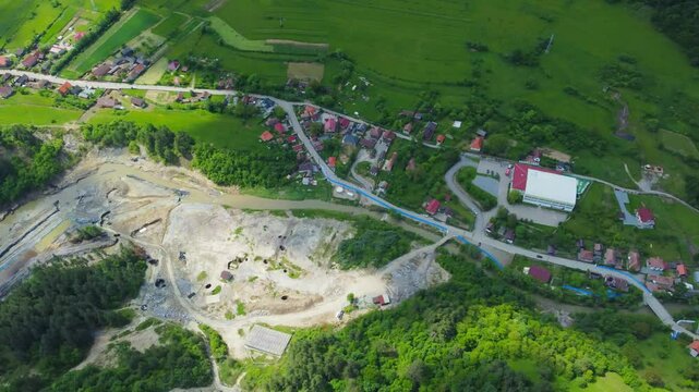 Aerial view of the place where the water of the Corund stream infiltrated the salt mine in Praid - Romania