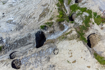 Aerial view of the pits and craters formed by the collapse of the Praid salt mine - Romania