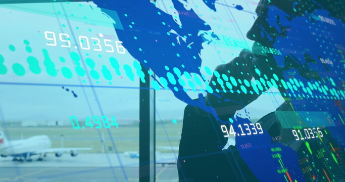 Image of world map and data processing over businessman using smartphone at airport - Powered by Adobe