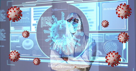 Image of covid 19 cells and data processing over caucasian male doctor in ppe suit
