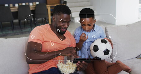 Naklejka premium Image of soccer field over african american father and son watching match in smartphone