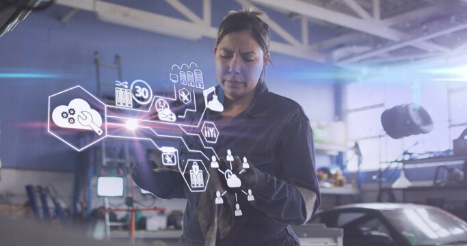 Image of tech icons in hexagons over caucasian female mechanic