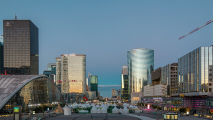 The stunning Defence Parisian business district bristling with skyscrapers day to night timelapse.
