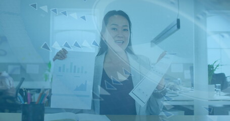 Image of data processing over asian businesswoman smiling in office