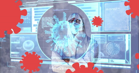 Image of covid 19 cells and data processing on interface over male medical worker in ppe suit