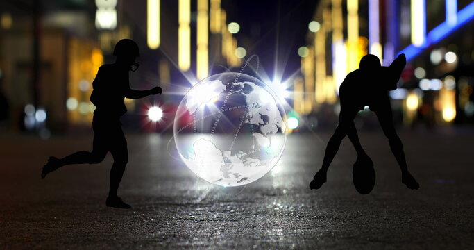 Image of globe and american footballer silhouettes over car on city street at night - Powered by Adobe