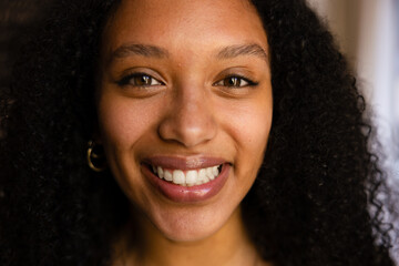 Portrait of a smiling woman with curly hair
