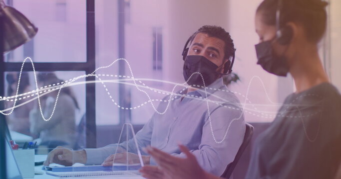 Image of data processing with white lines over diverse business people with face masks - Powered by Adobe