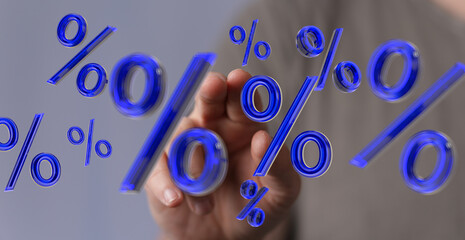 Hand interacting with 3D percentage symbols,ideal for finance, banking, and sales.