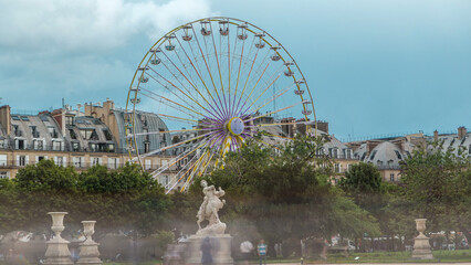 Fototapeta premium Ferris wheel Roue de Paris on Tuileries Garden timelapse. Paris, France.