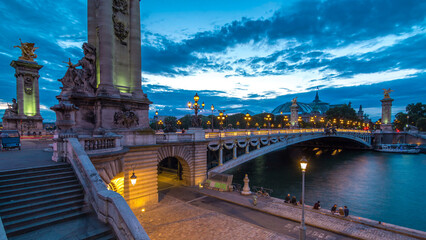 Alexandre Bridge in Paris at night in illumination day to night timelapse. Paris, France
