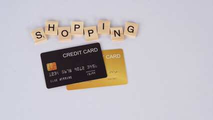 Credit cards and shopping words on white background.