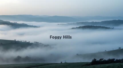 Foggy hills create a mysterious landscape at dawn with gentle rolling fog covering valleys