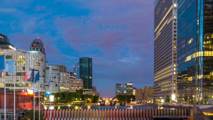 Obraz premium Paris cityscape with modern buildings in business district La Defense day to night timelapse. Paris, France
