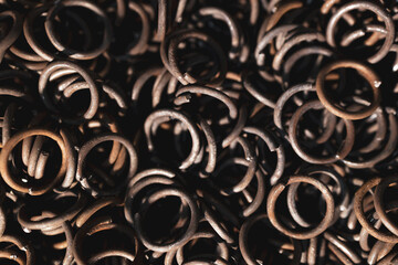 A pile of old, rusted metal rings