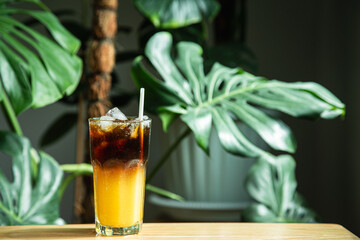 Iced Americano with refreshing orange juice, On table. Homemade coffee and juice ,Copy space for your text