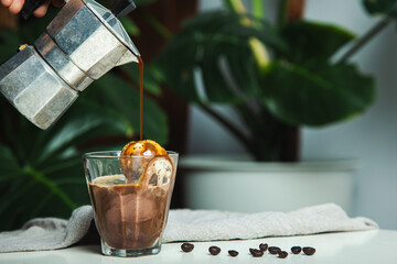 homemade Affogato, Italian Moka pot coffee , affogato is dessert with coffee as base ingredient typically scooping a scoop of gelato or vanilla ice cream into a cup.