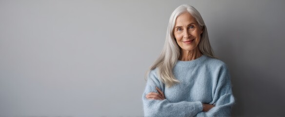 The smiling elderly woman showcasing elegance and serenity in a cozy sweater.