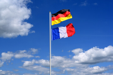 Partnership, relations between Germany and France symbolised by national flags