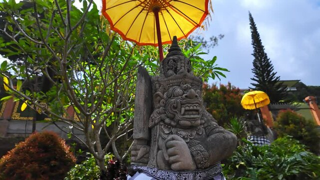 Stone Daemon in ancient Pura Tirta Empul Temple on Bali, Indonesia