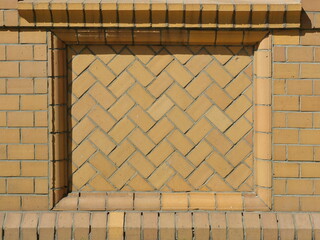 Facade with decorative brickwork in diagonal bond with yellow clinker. Yellow brick facade with...