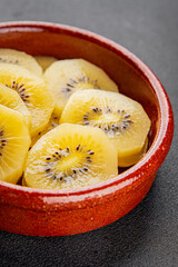 Kiwi yellow slices tasty fruit fresh delicious gourmet food background on table rustic food top view copy space keto and paleo diet vegan and vegetarian food