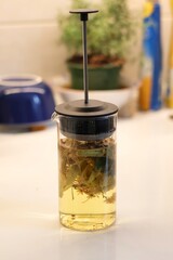 Linden blossom tea; Close-up of linden blossom brewed in a transparent vessel