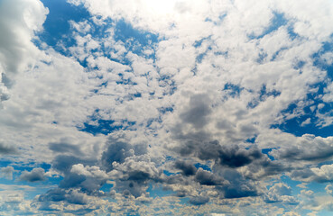 White light on clouds high in the sky, textured white clouds in white light close-up, view among...